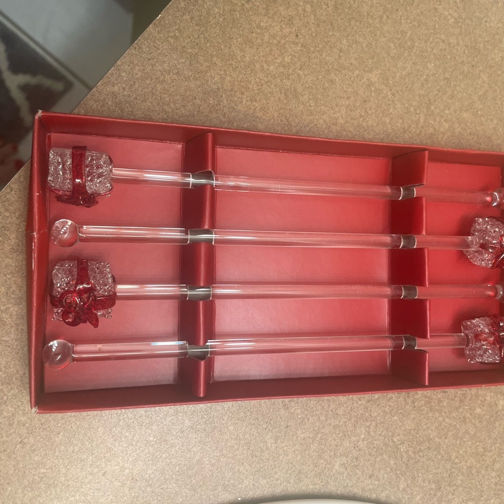 Pier one imports swivel sticks with Christmas packages for drinks